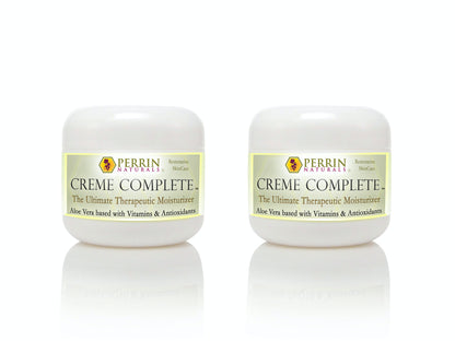 Two tubs of Perrin Naturals Creme Complete, the ultimate therapeutic moisturizer, with the brand logo and product information displayed on the labels.