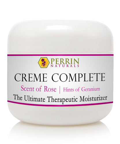 A white jar of Perrin Naturals Creme Complete with the scent of rose and hints of geranium. The label indicates it is the ultimate therapeutic moisturizer.